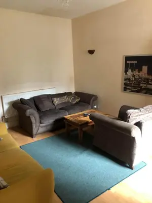 a living room with a couch and a coffee table at Room in town centre in Saint Helens