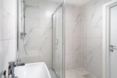 a bathroom with a shower and a sink at Modern 1 Bedroom Liverpool Apartment in Liverpool