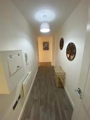 an empty hallway with a hallwayiteratoriteratorythonython at Modern 1 Bedroom Liverpool Apartment in Liverpool