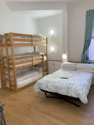 a bedroom with two bunk beds in a room at The Danescourt in Blackpool