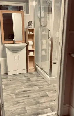 a bathroom with a sink and a shower at The Danescourt in Blackpool