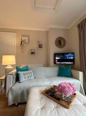 a living room with a couch and a tv at Leafy lodge in Lytham in Brown Moss Side