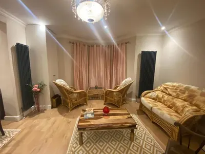 a living room with a couch and chairs and a table at 2 Bedroom New Flat In Blackpool Town Center in Blackpool