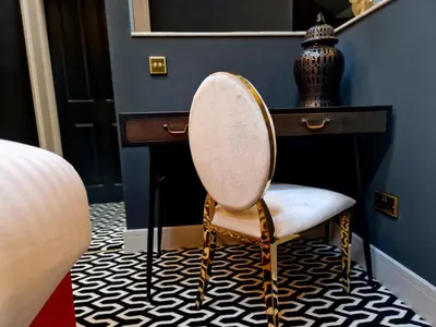 a chair sitting next to a desk in a room at The Hamilton - The Studio luxury holiday let's in Scorton