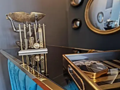 a dressing table with a gold object on top of it at The Hamilton - The Studio luxury holiday let's in Scorton