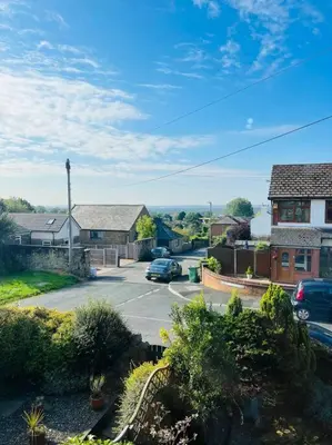 a view of a street in a residential neighborhood at Willow Cottage - Billinge Wigan, sleeps 4 , parking and garden in Billinge