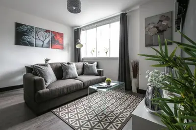 a living room with a couch and a table at *Liverpool City Centre Modern Stylish Apartment in Liverpool