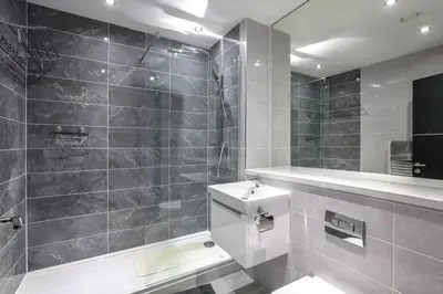 a bathroom with a toilet and a sink and a mirror at *Liverpool City Centre Modern Stylish Apartment in Liverpool