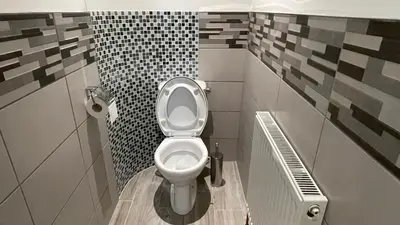 a bathroom with a white toilet in a room at ANFIELD PLACE TO STAY in Liverpool