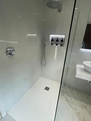 a white bathroom with a shower and a sink at Home in Wirral - Peaceful Contemporary Gem. in Wirral