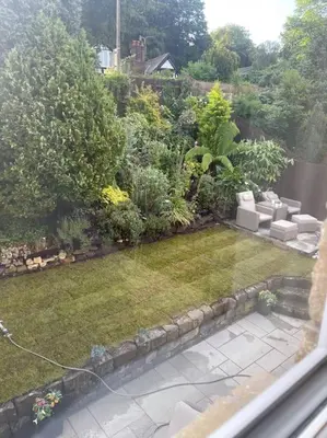 a view of a garden from a window at Home in Wirral - Peaceful Contemporary Gem. in Wirral