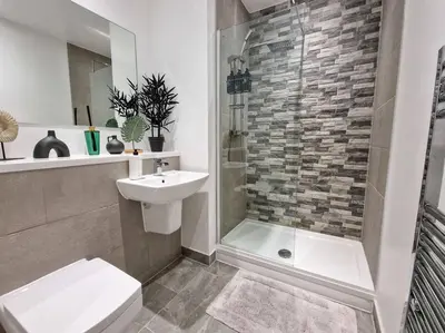 a bathroom with a sink and a toilet and a shower at Liverpool Baltic Flat in Liverpool