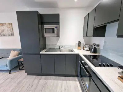 a kitchen with a sink and a microwave at Liverpool Baltic Flat in Liverpool