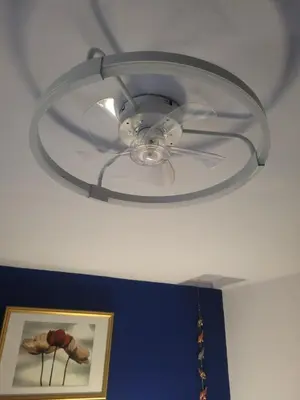 a ceiling fan is hanging from a ceiling at Morecambe Seaside Room in Heysham