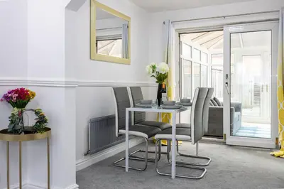 a dining room with a table and chairs at E&E's House in Cherry Tree