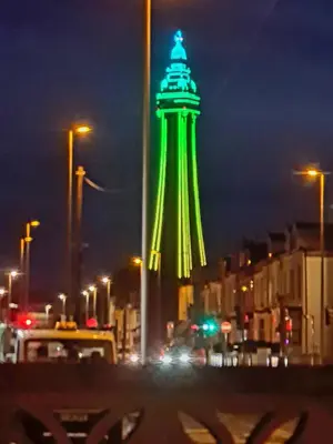 a lit up tower on a city street at night at Tower Views 2 Bedroom House with Private Parking in Blackpool
