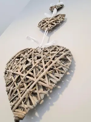 a wicker heart on a white table with two hooks at Tower Views 2 Bedroom House with Private Parking in Blackpool