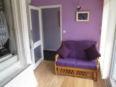 a purple couch in a room with a purple wall at The Middleton in Blackpool