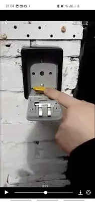 a person holding a remote control in a wall at Townsend Studio/Rooms in Liverpool