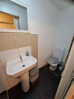 a bathroom with a sink and a toilet at Townsend Studio/Rooms in Liverpool