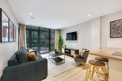 a living room with a couch and a table at Host & Stay - Henry Street Chambers in Liverpool