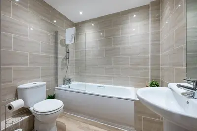 a bathroom with a toilet and a tub and a sink at Host & Stay - Henry Street Chambers in Liverpool