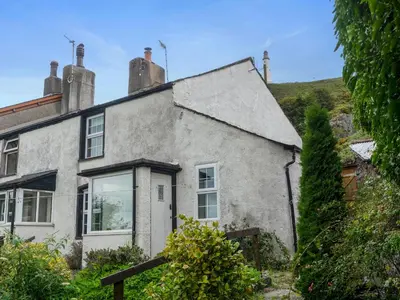 an old house with a pitched roof at Quaint Cottage Retreat in Charming Ulverston - Pass the Keys in Ulverston