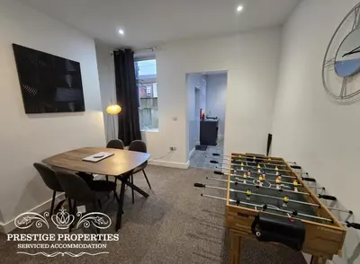 a room with a ping pong table and a room with a bill at 38 Gloucester street by Prestige Properties SA in Barrow in Furness