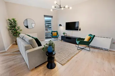 a living room with a couch and two chairs at Host & Stay - Ropewalks Quarters in Liverpool
