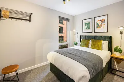 a bedroom with a large bed and a window at Host & Stay - Ropewalks Quarters in Liverpool