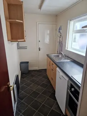 a small kitchen with a sink and a window at Vance House in Blackpool
