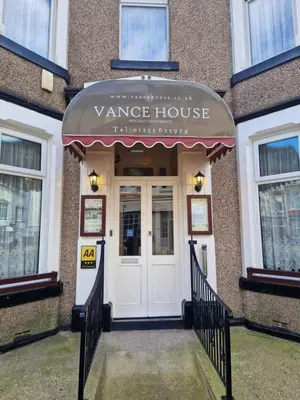 a entrance to a wine house with a white door at Vance House in Blackpool