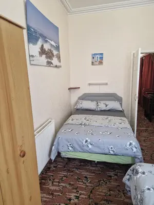 a small bedroom with a bed in a room at Vance House in Blackpool