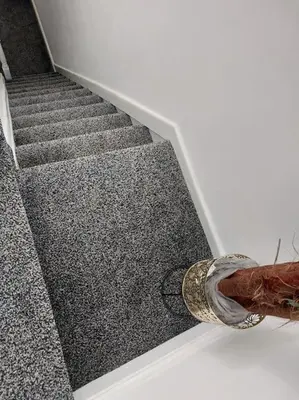 a snake laying on the side of a staircase at 4 Double Bedroom House in Accrington sleeps 6 in Accrington