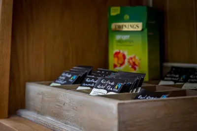a wooden box filled with different types of chocolate at The Beechcliffe Hotel - Over 35's Only in Blackpool