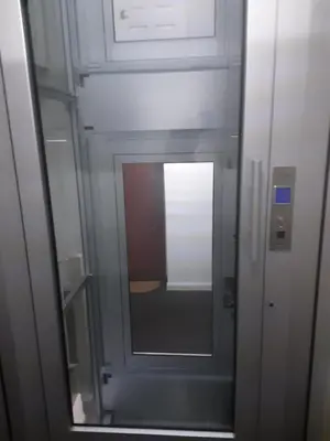 a bathroom door with a mirror in a room at Morecambe Central balcony with sea view in Morecambe