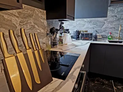 a kitchen with a counter with a stove top oven at The Studio in Preston