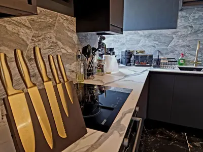 a kitchen with a counter with a stove top oven at The Studio in Preston
