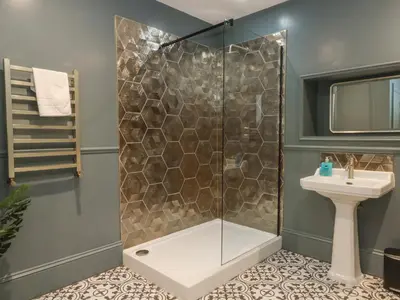 a bathroom with a shower and a sink at Alexander in Preston