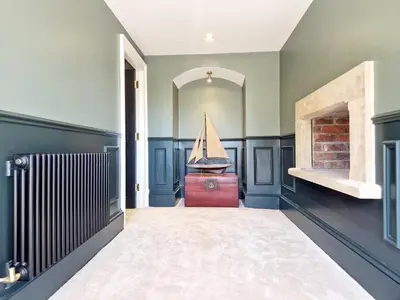a hallway with a room with a boat on the wall at The Duke in Preston
