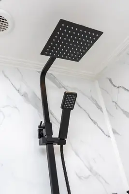 a black lamp hanging from the ceiling in a room at Riversleigh in Warton