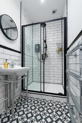 a bathroom with a shower and a sink at Bifolds, enclosed garden. Southport character home in Southport