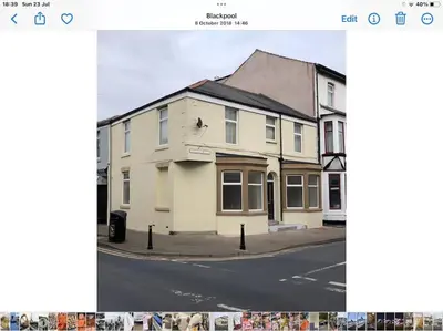 a picture of a white house on a street at O’er The Yard Hideaway in Blackpool