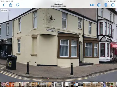 a building on the corner of a street at O’er The Yard Hideaway in Blackpool