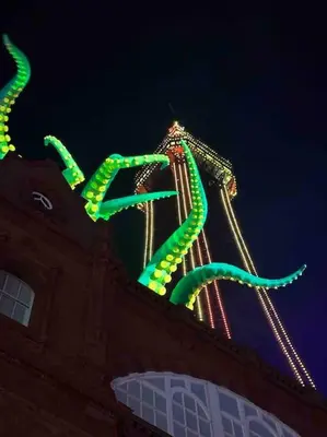 a large neon sign on the side of a building at O’er The Yard Hideaway in Blackpool