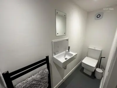 a bathroom with a sink and a toilet at Ye Olde Original Withy Trees in Bamber Bridge