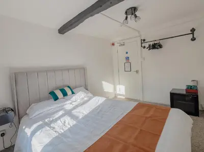a bedroom with a large bed in a room at Ye Olde Original Withy Trees in Bamber Bridge