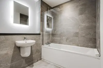a bathroom with a sink and a tub and a toilet at GuestReady - Delightful getaway in Liverpool in Liverpool