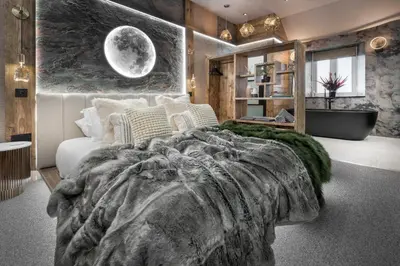 a bedroom with a large bed and a bath tub at Coronation Cottages, Modernised 200-Year-Old Lake District Cottage Getaway for Two - Ridgestone in Lindale