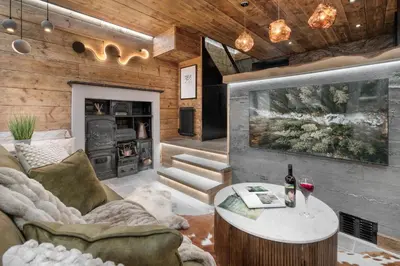 a living room with a couch and a table at Coronation Cottages, Modernised 200-Year-Old Lake District Cottage Getaway for Two - Ridgestone in Lindale